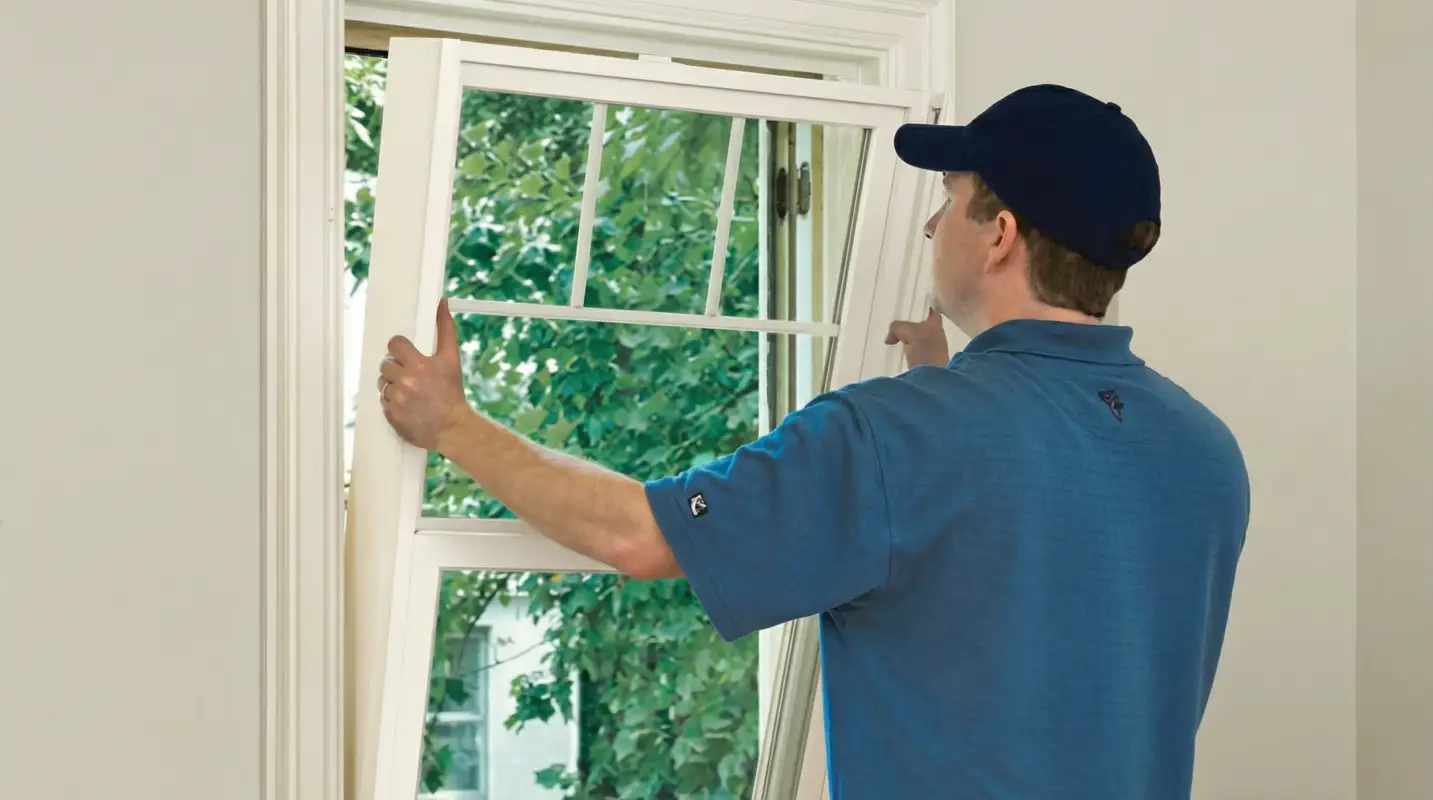 Professional contractors performing a residential window insulation and replacement service in Tempe, AZ